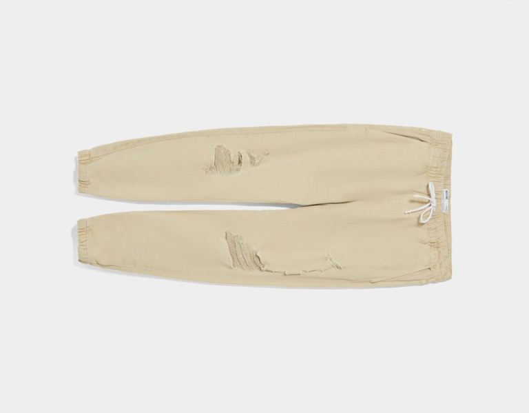 Bershka Ripped Jogger Jeans Heren Beige | JPgjEgyMiEa